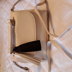 RAMPAGE cream vegan leather crossbody bag w/ adj. strap,2 decorative tassels.